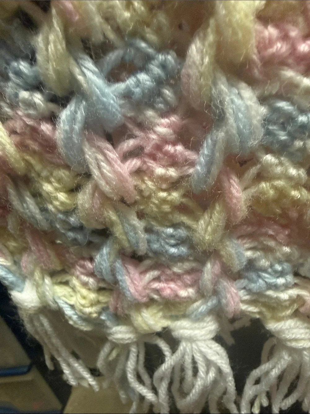 White Crochet Baby Throw with Pastel Pink, Blue, and Yellow Accents